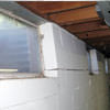 A foundation showing severe inward buckling along the windows in a Petaluma home.