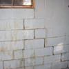 A cracked foundation wall near a window in a Fair Oaks home