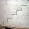 A diagonal stair step crack along the foundation wall of a San Rafael home