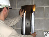 Mounting a foundation wall plate for an earth anchor installation in Citrus Heights.