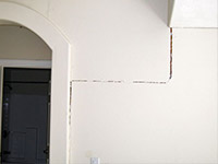 Drywall cracking due to foundation settlement in Woodland