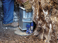 Securing a foundation footing bracket for a foundation repair system in Folsom.